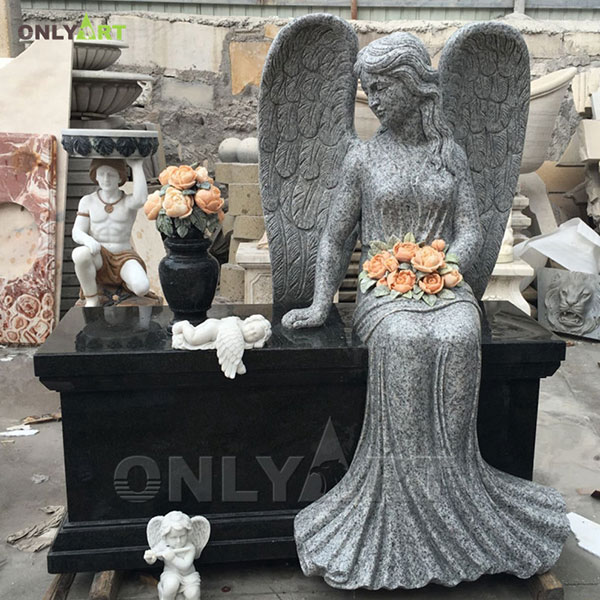 Black marble headstone angel sitting on tombstone OLA-T078