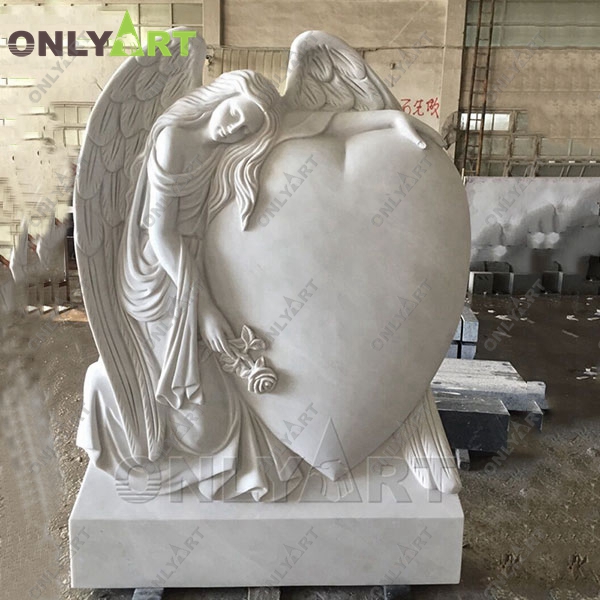 angel statue holding heart