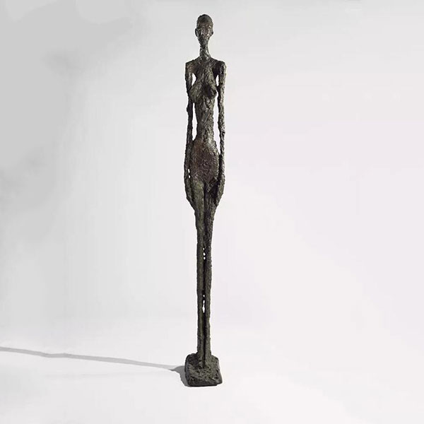 standing woman statue by Giacometti