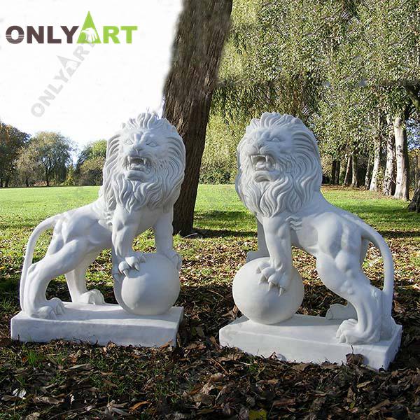 Life size white marble lion statues with ball