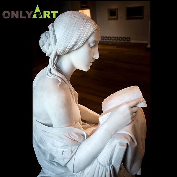 girl reading a book statue